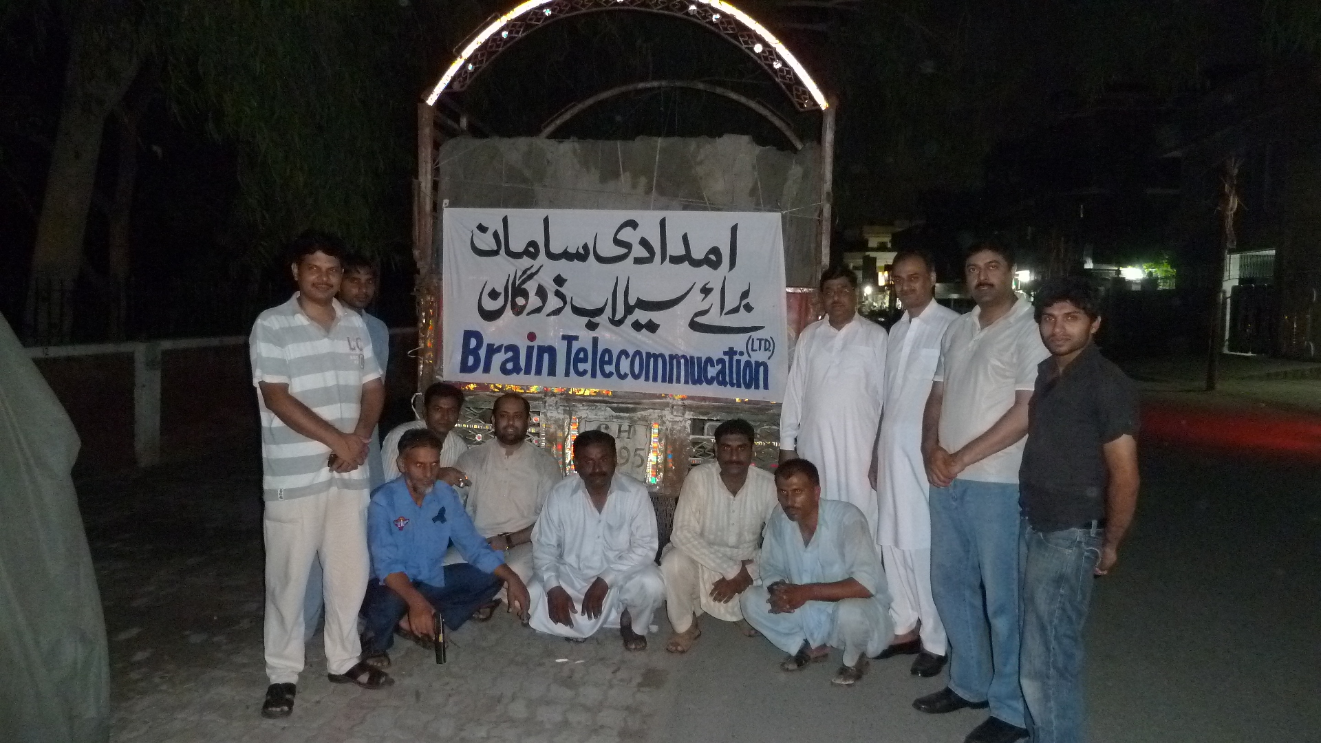 BrainTEL flood relief efforts showing team members distributing aid to affected communities